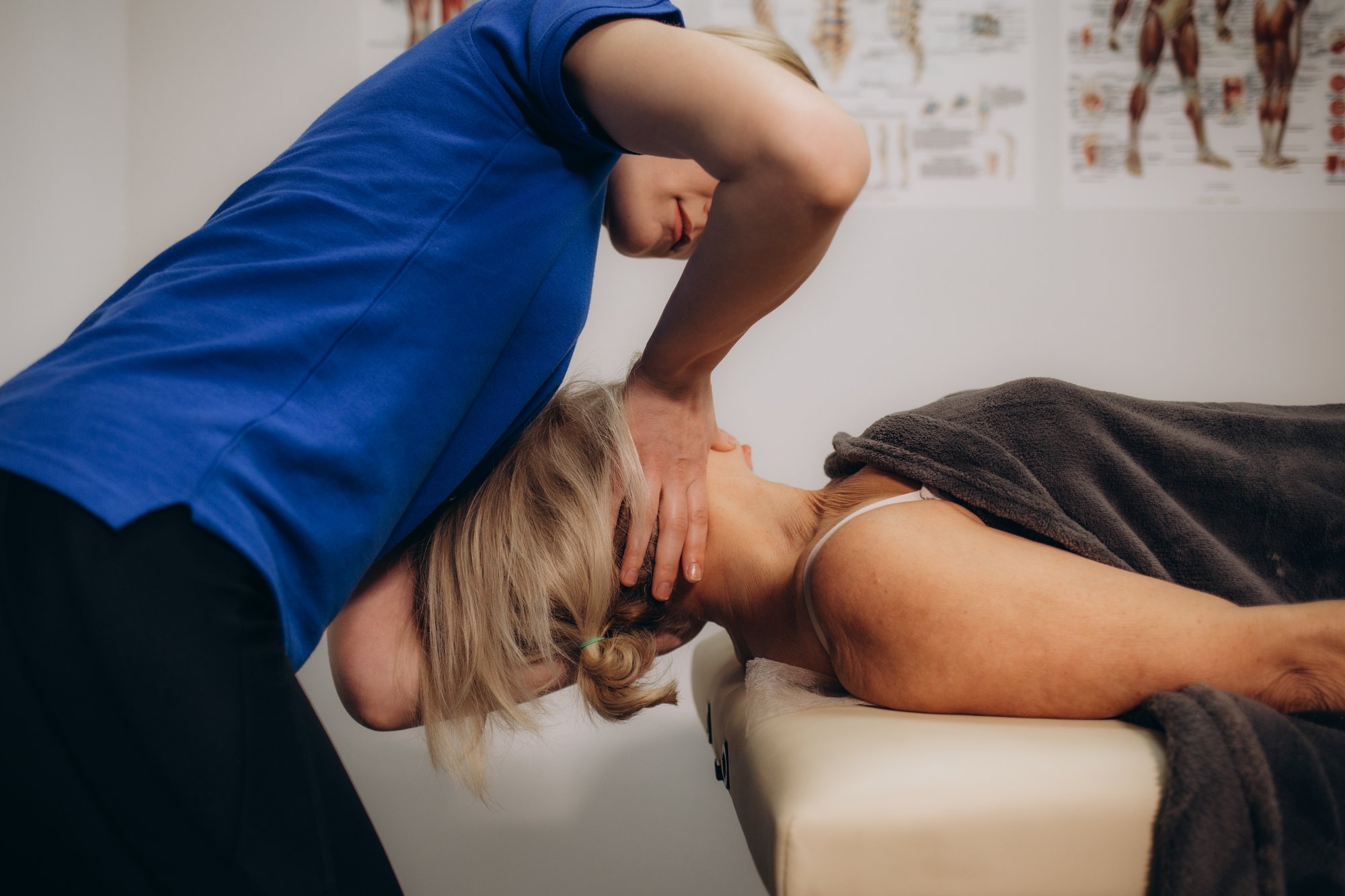 physiotherapist-helping-senior-woman-with-elbow-ex-2025-03-14-04-31-59-utc